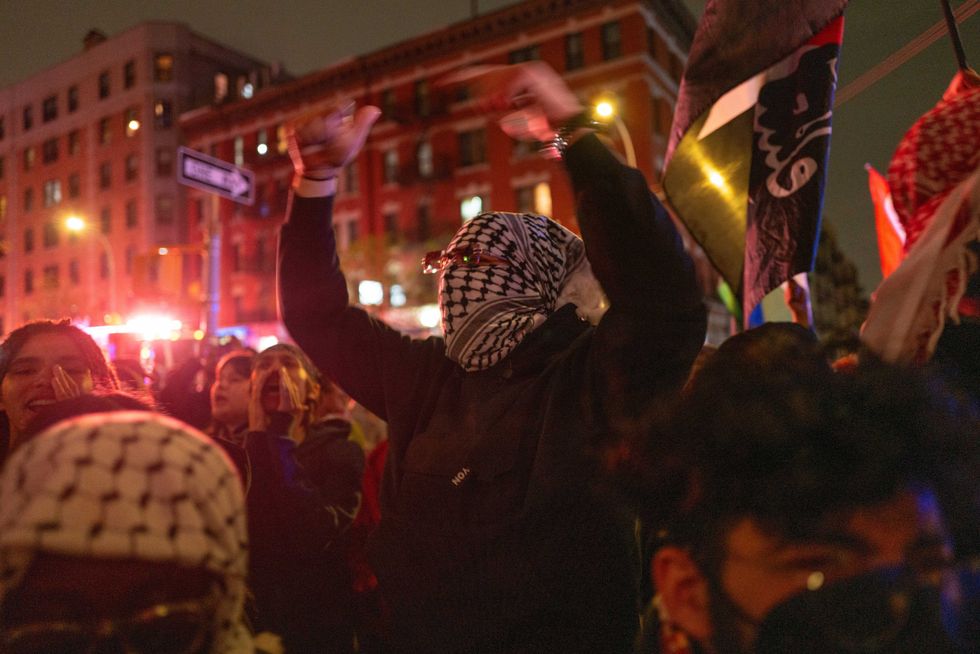 Pro-Palestinian supporters confront police during demonstrations at The City College Of New York (CUNY) on April 30, 2024