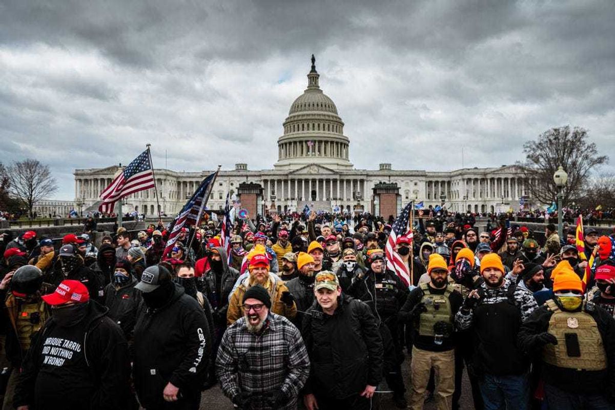 Pro-Trump protesters gather in front of the U.S. Capitol Building on January 6, 2021 in Washington, DC. A pro-Trump mob stormed the Capitol, breaking windows and clashing with police officers. Trump supporters gathered in the nation's capital today to protest the ratification of President-elect Joe Biden's Electoral College victory over President Trump in the 2020 election. (Photo by Jon Cherry/Getty Images)