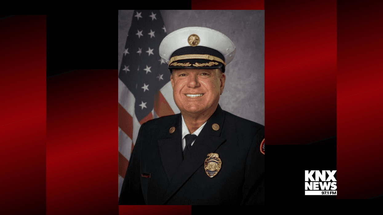 professional portrait of white man in fire captain uniform