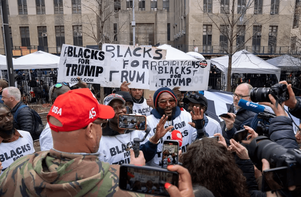 Protesters and media gather outside the Manhattan Criminal Courthouse in New York City. Former President Donald Trump is expected to be arraigned on Tuesday, April 4, 2023, at the Manhattan Criminal Courthouse in New York City after a grand jury voted to indict him