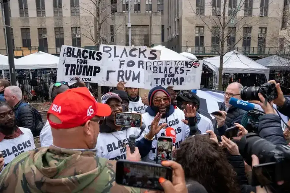 Protesters and media gather outside the Manhattan Criminal Courthouse in New York City. Former President Donald Trump is expected to be arraigned on Tuesday, April 4, 2023, at the Manhattan Criminal Courthouse in New York City after a grand jury voted to indict him.