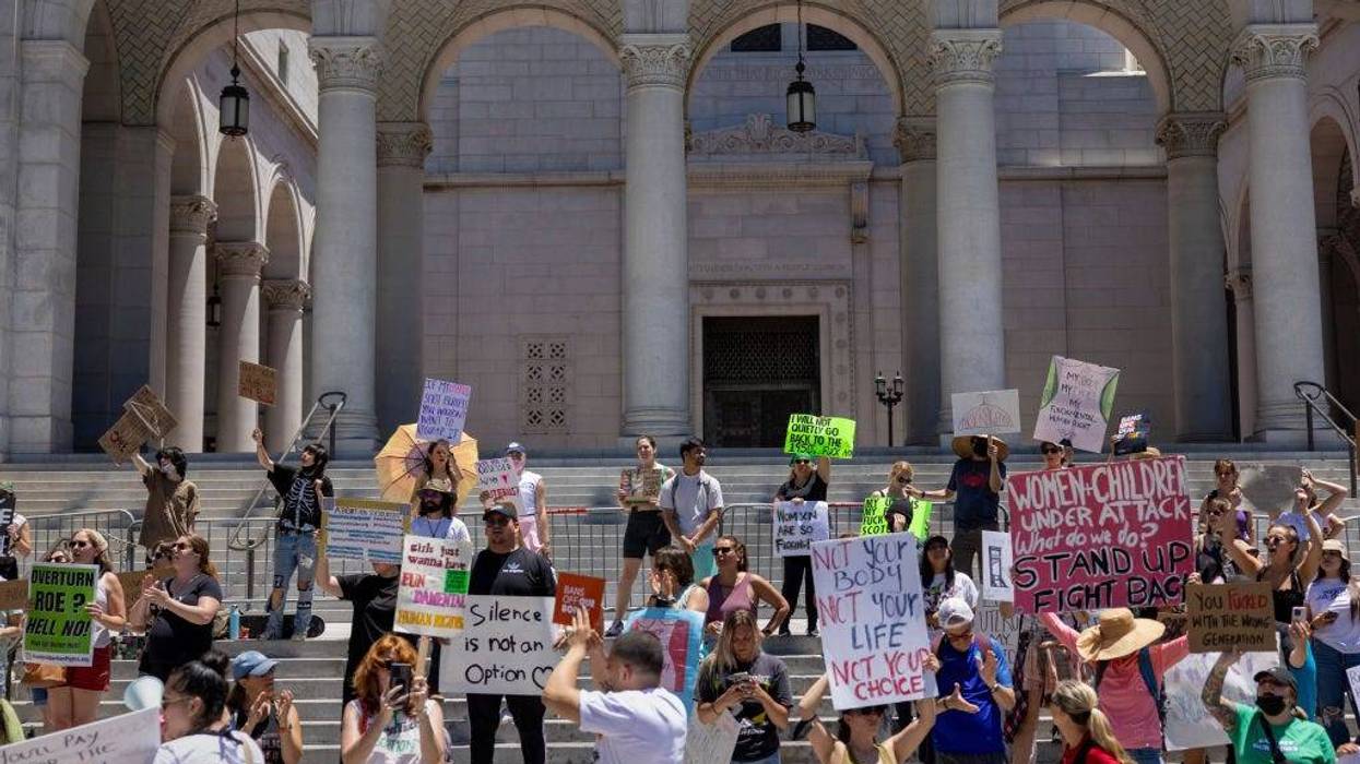 Protesters denounce the U.S. Supreme Court's decision to end abortion rights protections at the steps of City Hall on June 25, 2022 in Los Angeles, California. The Supreme Court's decision in the Dobbs v Jackson Women's Health overturned the landmark 50-year-old Roe v Wade case and erased a federal right to an abortion. (Photo by David McNew/Getty Images)