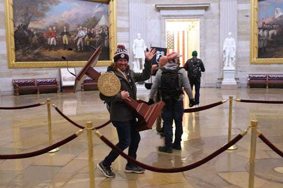 Protesters enter the U.S. Capitol Building on January 6, 2021 in Washington, DC. Congress held a joint session today to ratify President-elect Joe Biden