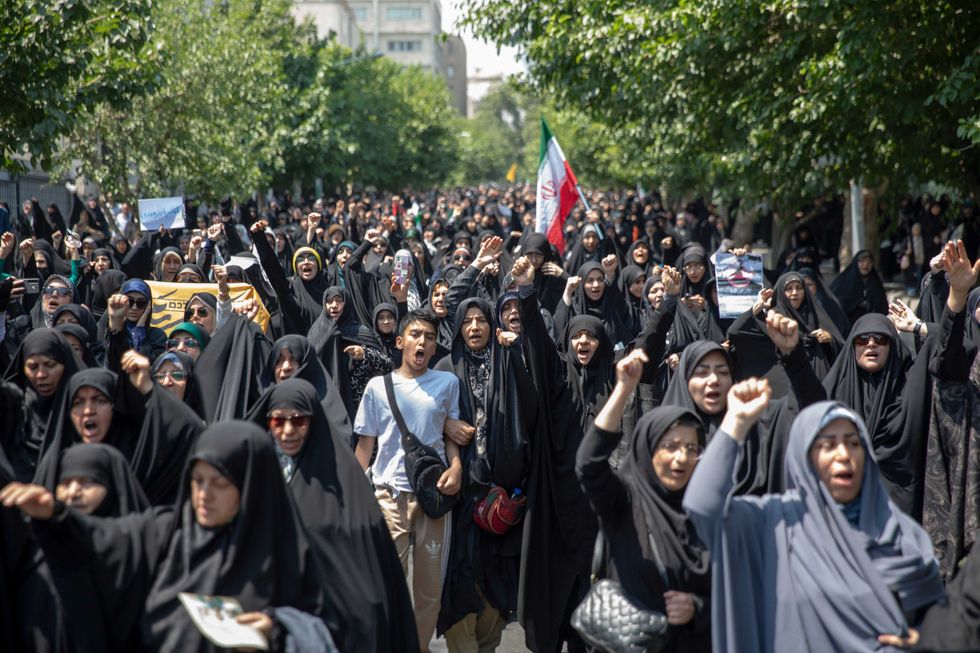 Protesters gather in Enqelab Square in Tehran after Israel launched a series of strikes on June 13, 2025