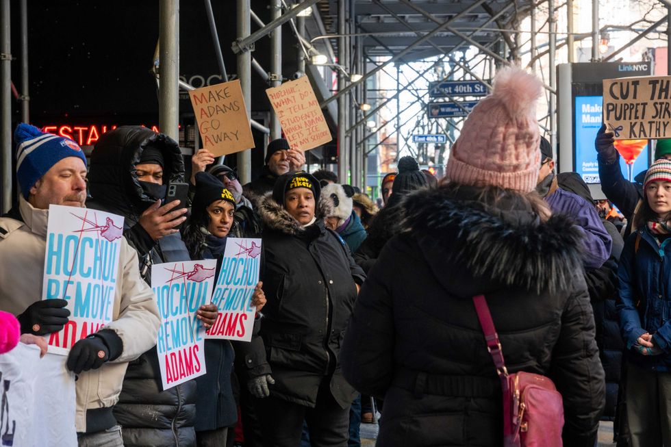 Protesters gather in front of Gov. Kathy Hochul