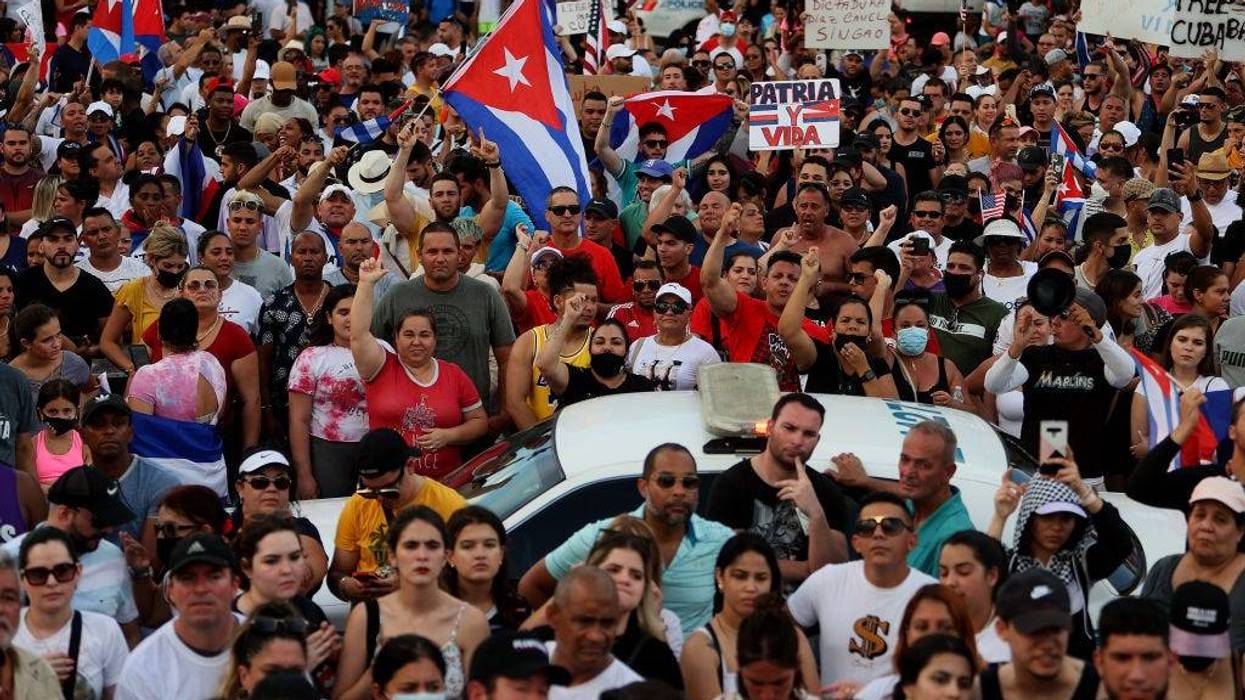 Protesters gather in front of the Versailles restaurant to show support for the people in Cuba who have taken to the streets there to protest on July 11, 2021 in Miami, Florida. Thousands of Cubans took to the streets across the country to protest pandemic restrictions, the pace of Covid-19 vaccinations and the Cuban government.
