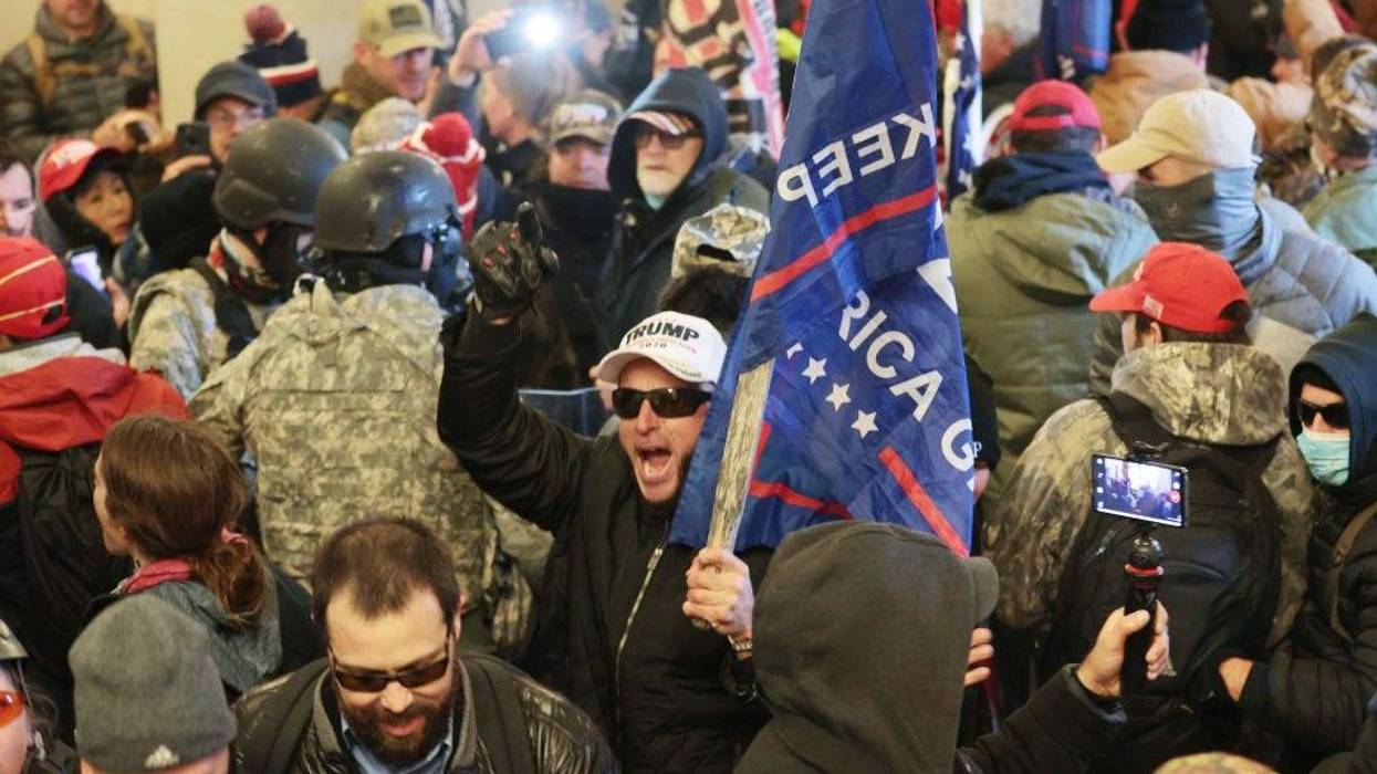 Protesters gather inside the U.S. Capitol Building on January 06, 2021 in Washington, DC. Congress held a joint session today to ratify President-elect Joe Biden's 306-232 Electoral College win over President Donald Trump. A group of Republican senators said they would reject the Electoral College votes of several states unless Congress appointed a commission to audit the election results. (Photo by Win McNamee/Getty Images)