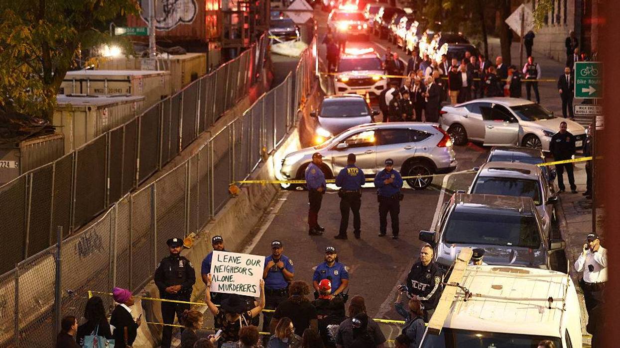Protesters gather near the scene where a man was shot by an Immigration and Customs Enforcement (ICE) officer during an operation in the Marble Hill neighborhood of New York on October 8, 2026, according to local media and police.