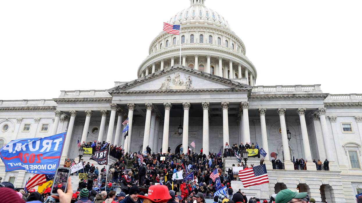 Protesters gather on the U.S. Capitol Building on January 06, 2021 in Washington, DC. Pro-Trump protesters entered the U.S. Capitol building after mass demonstrations in the nation's capital during a joint session Congress to ratify President-elect Joe Biden's 306-232 Electoral College win over President Donald Trump.