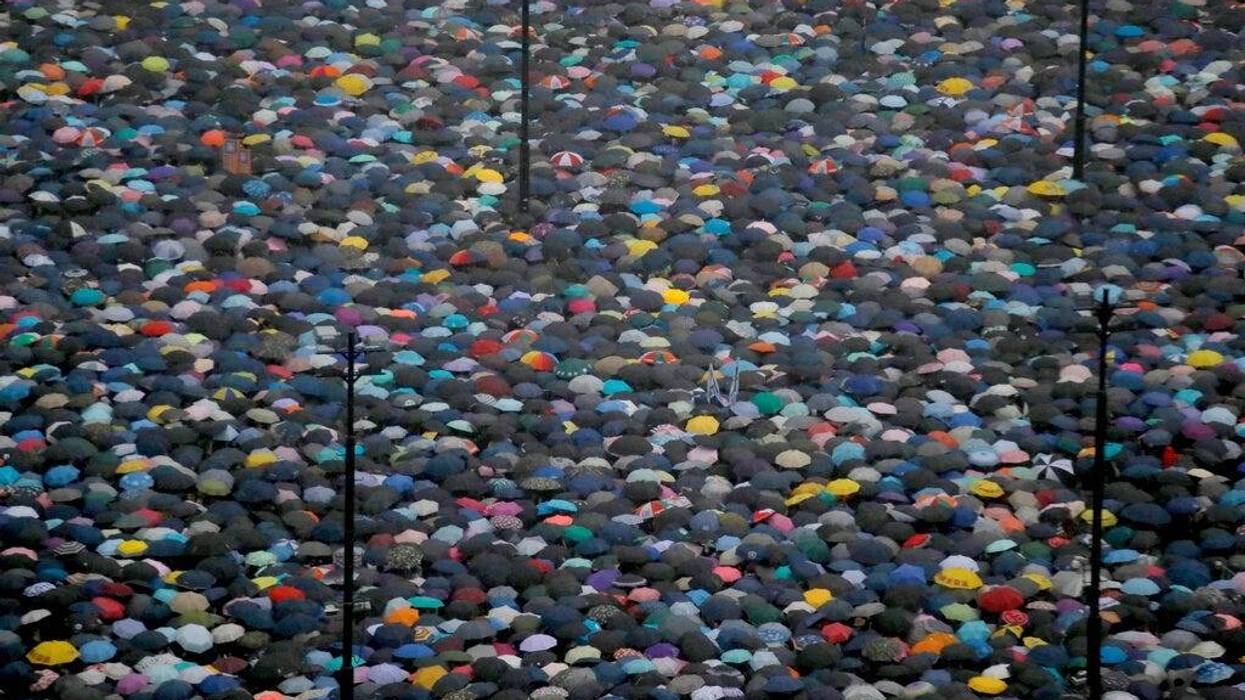 Protesters gather on Victoria Park in Hong Kong Sunday, Aug. 18, 2019. Thousands of people streamed into the park for what organizers hope will be a peaceful demonstration for democracy in the semi-autonomous Chinese territory.