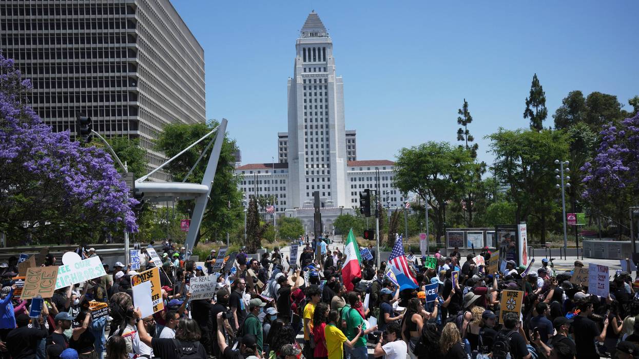 Protesters gather outside City Hall, Monday, June 9, 2025, in downtown Los Angeles.