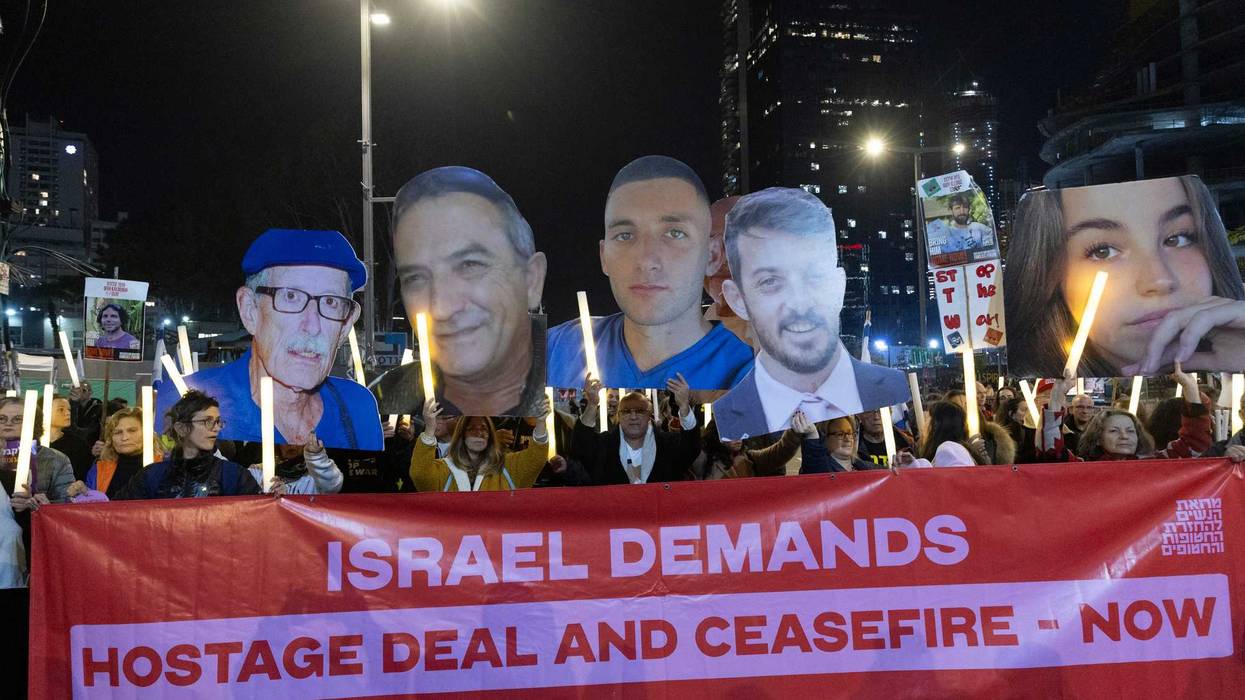 Protesters hold photos of hostages held in the Gaza Strip during a rally calling for a hostages deal on January 4, 2025 in Tel Aviv, Israel.