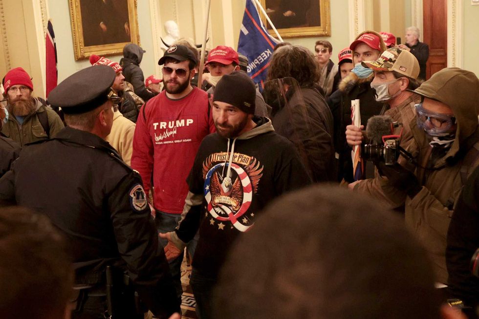 Protesters interact with Capitol Police inside the U.S. Capitol Building on January 06, 2021 in Washington, DC. Congress held a joint session today to ratify President-elect Joe Biden