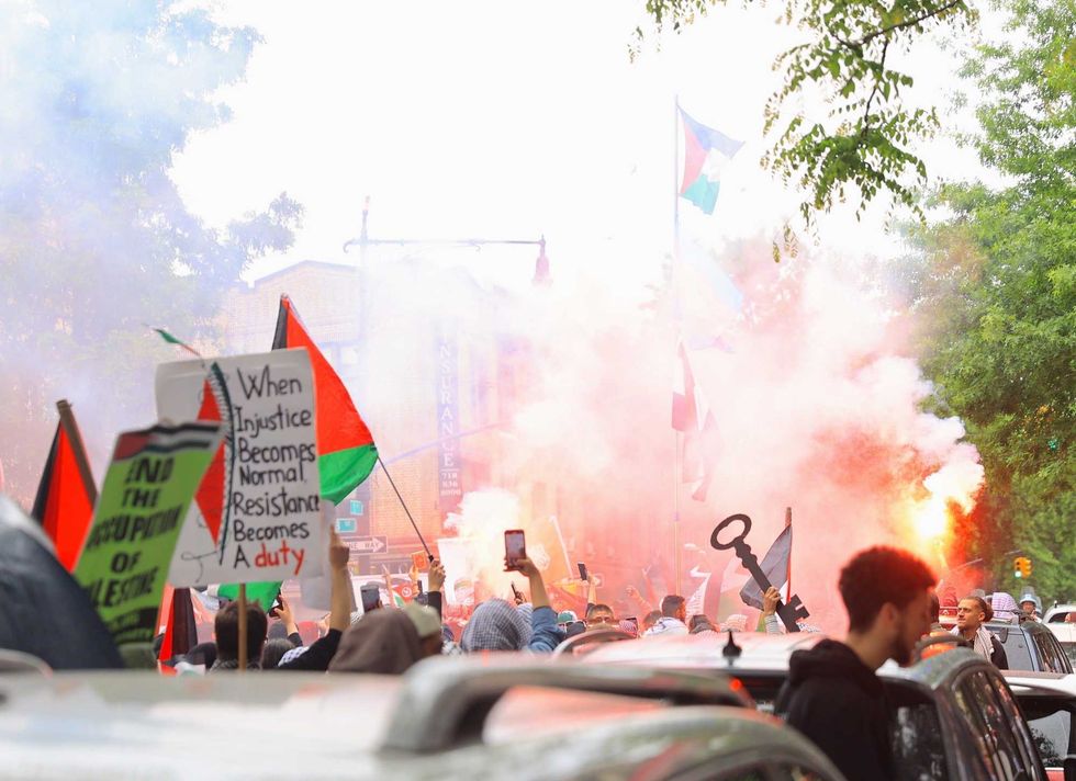 Protesters light flares in Bay Ridge during Saturday