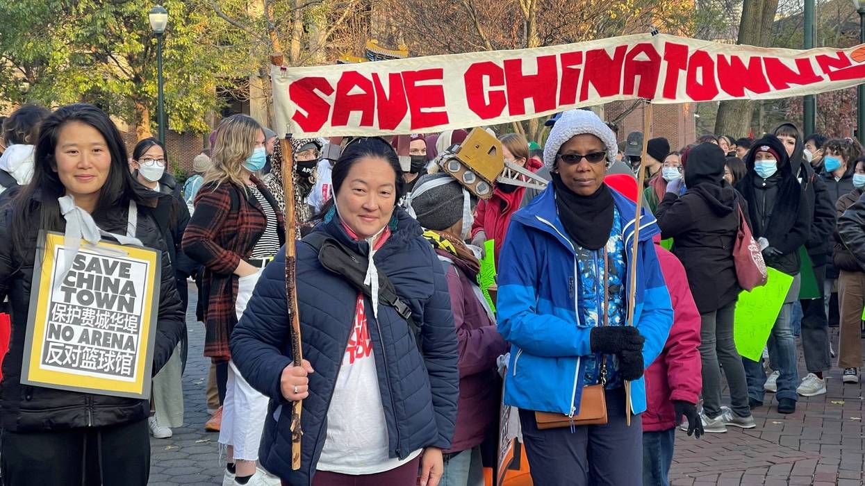 Protesters march against the planned new Philadelphia 76ers arena which would border Chinatown.