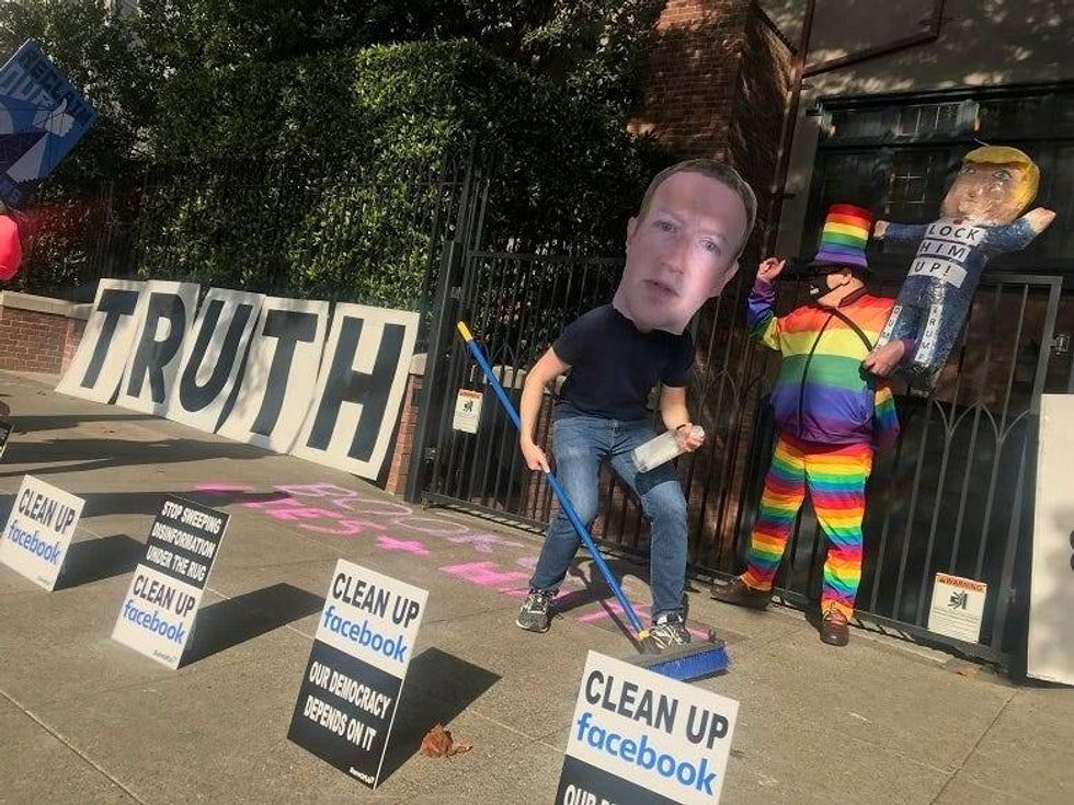 Protesters marched in front of Facebook CEO