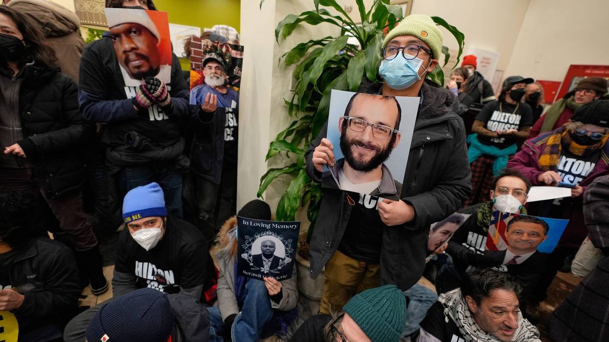 Protesters stage a sit-in in the lobby of a Hilton Garden Inn in New York, Tuesday, Jan. 27, 2026