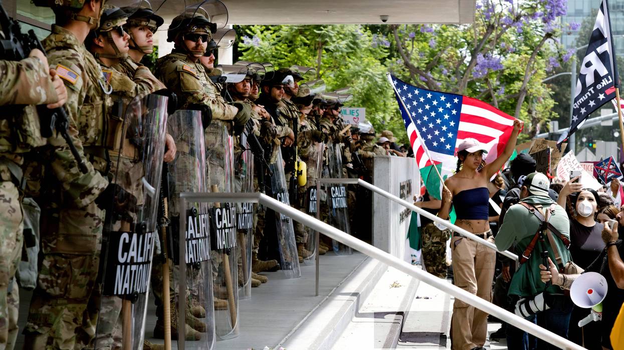 Protesters stand off against California National Guard soldiers at the Federal Building in downtown Los Angeles during a "No Kings" protest on Saturday, June 14, 2025.