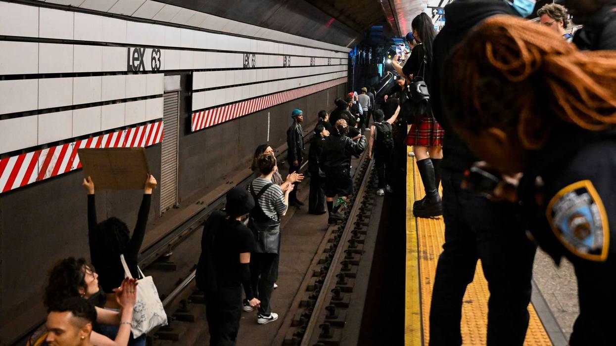 Protesters stand on the train tracks at the Lexington Ave/63rd Street subway station during a "Justice for Jordan Neely" protest on May 6, 2023