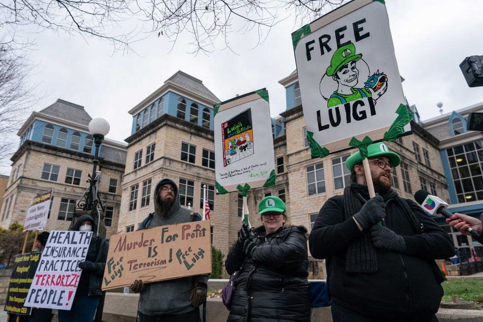 Protesters stand outside Blair County Courthouse in Hollidaysburg, Pennsylvania, on December 19, 2024