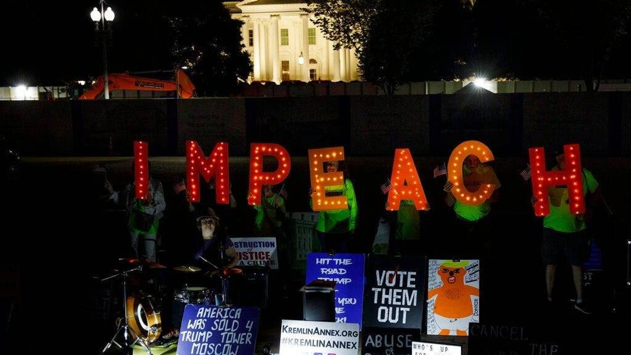 Protesters with "Kremlin Annex" call to impeach President Donald Trump in Lafayette Square Park in front of the White House in Washington, Tuesday, Sept. 24, 2019.