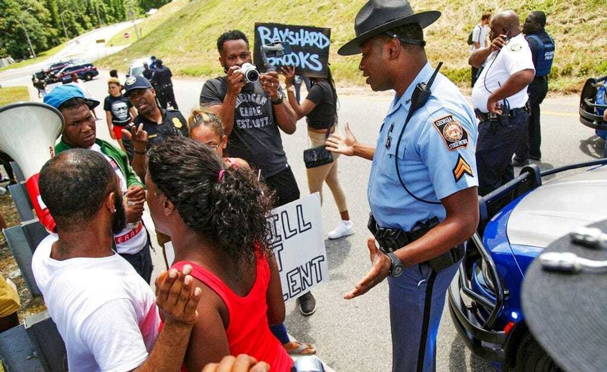 Protestors gather on University Ave near a Wendy's restaurant, Saturday, June 13, 2020 in Atlanta.