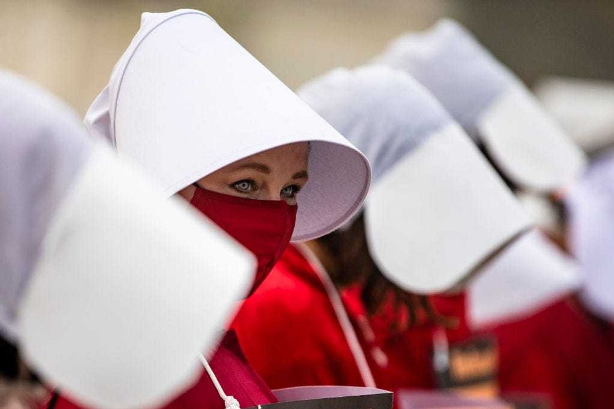 Protestors have worn Handmaid's Tale outfits before. Here, they stand outside of the United States Supreme Court on October 22, 2020 in Washington, DC.