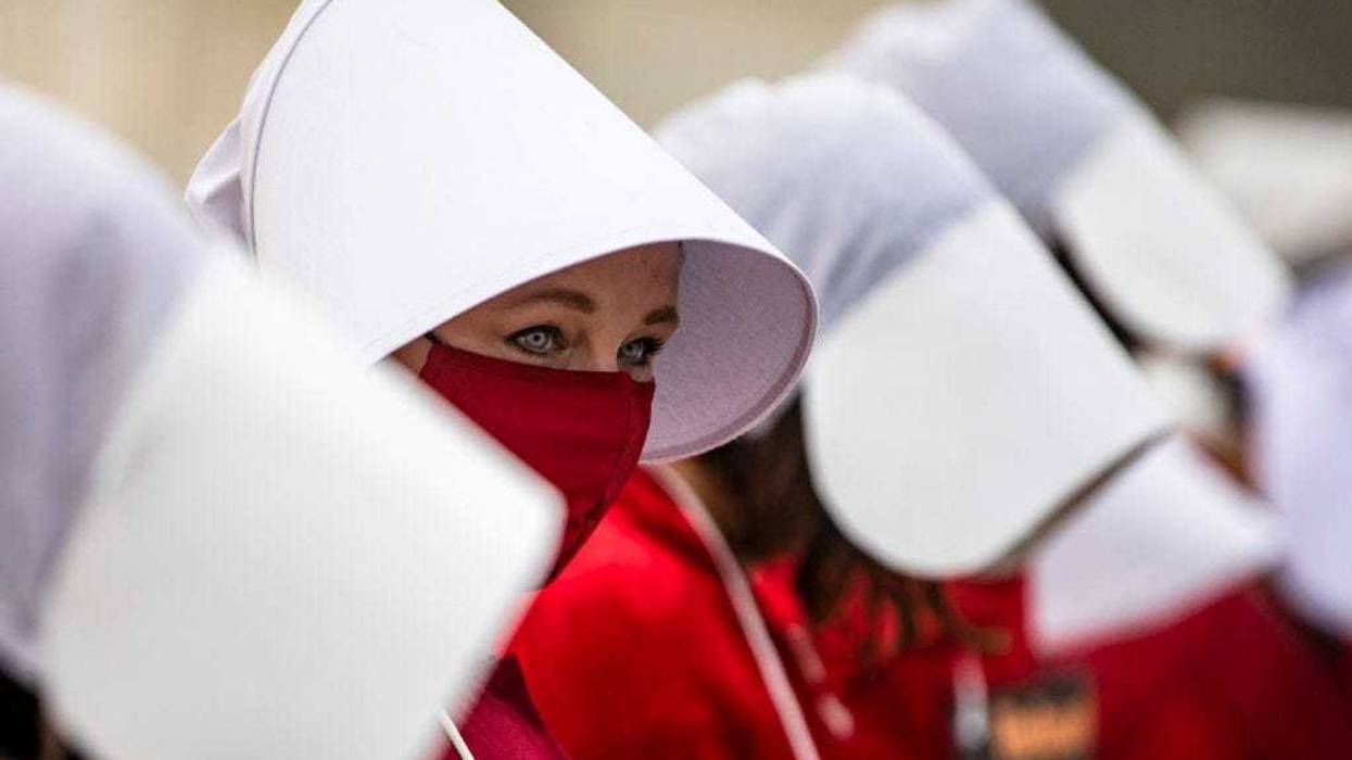 Protestors have worn Handmaid's Tale outfits before. Here, they stand outside of the United States Supreme Court on October 22, 2020 in Washington, DC.