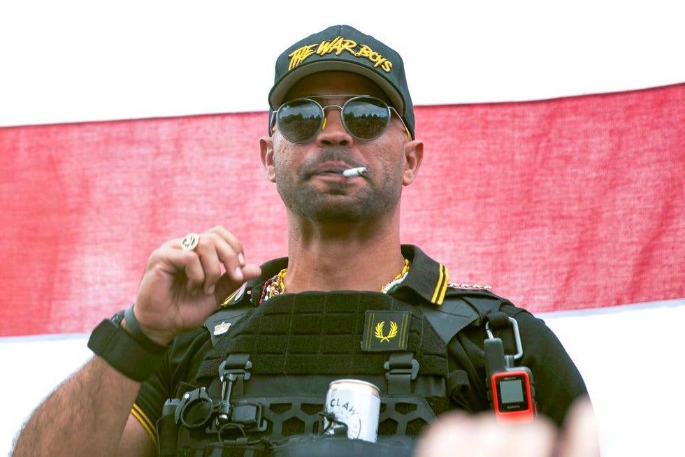 Proud Boys leader Henry "Enrique" Tarrio wears a hat that reads "The War Boys" during a rally in Portland, Ore., Sept. 26, 2020.