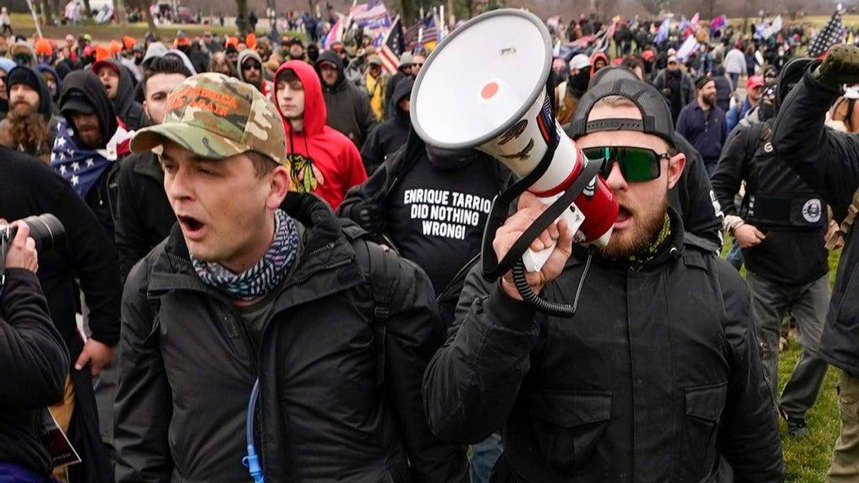 Proud Boys members Zachary Rehl, left, and Ethan Nordean, right, walk toward the U.S. Capitol in Washington, in support of President Donald Trump on Jan. 6, 2021.