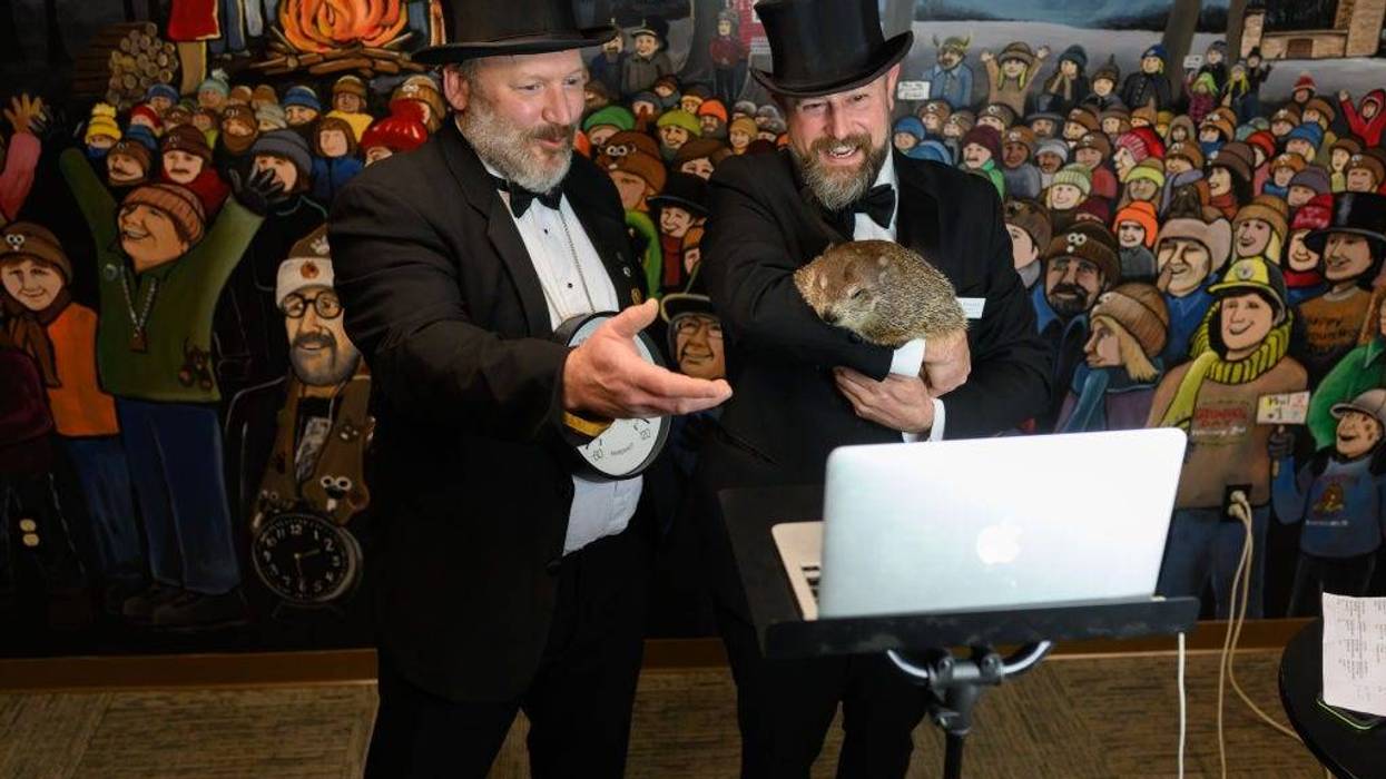 Punxsutawney Groundhog Club Inner Circle Members Jason Gursky and official handler, AJ Dereume and Punxsutawney Phil