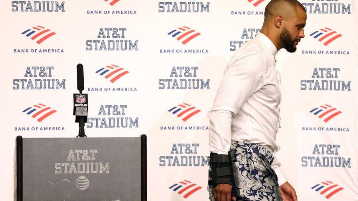 Quarterback Dak Prescott #4 of the Dallas Cowboys walks away from the podium during the post-game press conference after a 19-3 loss against the Tampa Bay Buccaneers at AT&T Stadium on September 11, 2022 in Arlington, Texas. Prescott left the game with a hand injury in the fourth quarter.