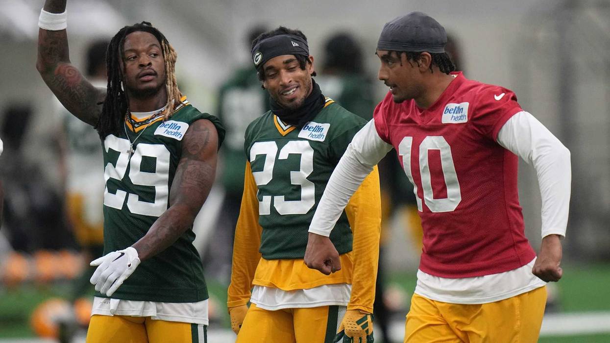Quarterback Jordan Love (10) jokes around with cornerback Jaire Alexander (23) and safety Xavier McKinney (29) during organized team activities for the Green Bay Packers Tuesday, May 21, 2024 in Green Bay, Wisconsin.