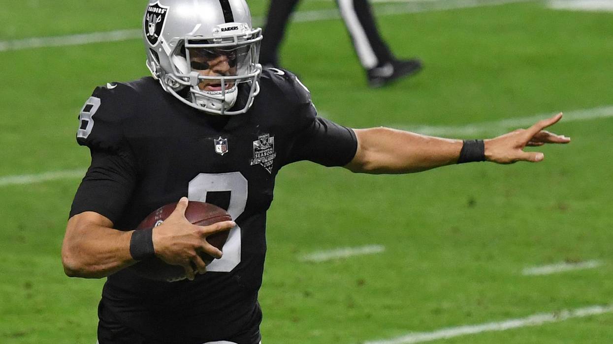 Quarterback Marcus Mariota #8 of the Las Vegas Raiders runs for a 2-yard touchdown against the Los Angeles Chargers in the second half of their game at Allegiant Stadium on December 17, 2020 in Las Vegas, Nevada.