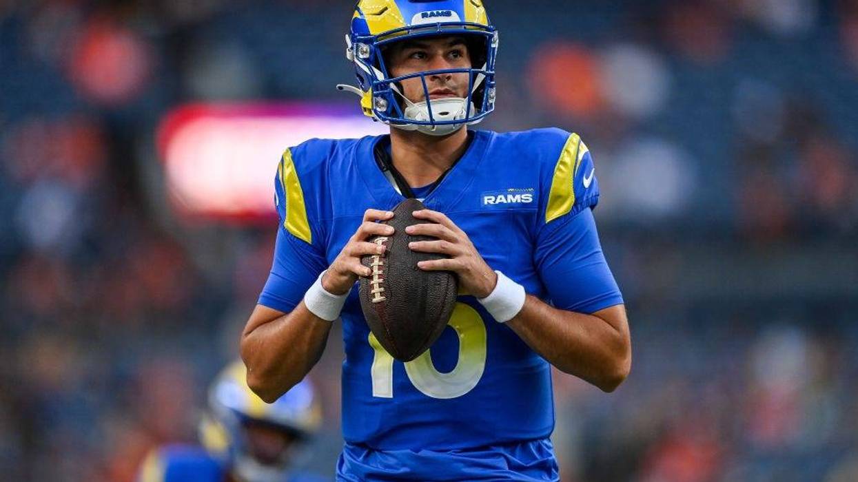 Quarterback Stetson Bennett #13 of the Los Angeles Rams warms up before a preseason game against the Denver Broncos at Empower Field at Mile High on August 26, 2023 in Denver, Colorado.