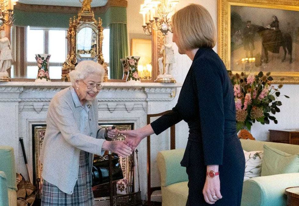 Queen Elizabeth greets newly elected leader of the Conservative party Liz Truss as she arrives at Balmoral Castle for an audience where she will be invited to become Prime Minister and form a new government on September 6, 2022 in Aberdeen, Scotland. The Queen broke with the tradition of meeting the new prime minister and Buckingham Palace, after needing to remain at Balmoral Castle due to mobility issues. (Photo by Jane Barlow - WPA Pool/Getty Images)