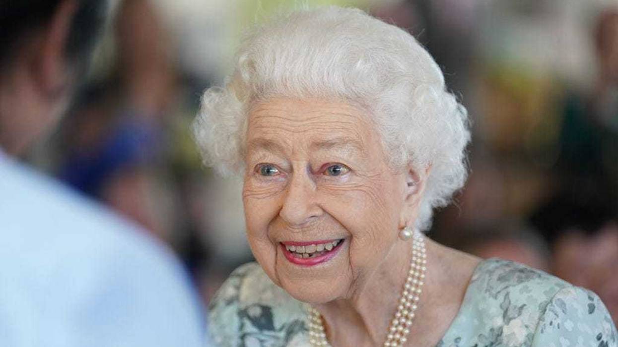 Queen Elizabeth II smiles during a visit to officially open the new building at Thames Hospice on July 15, 2022 in Maidenhead, England.