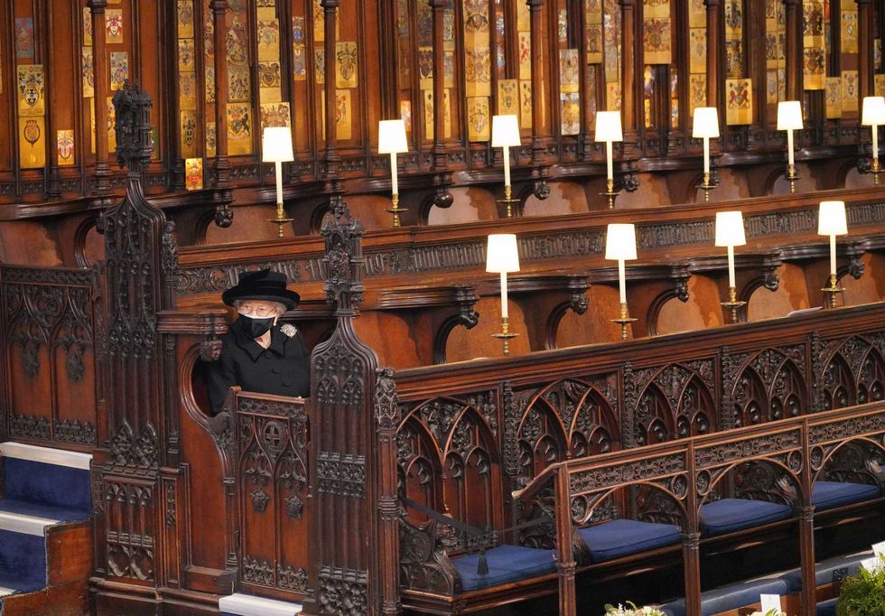 Queen Elizabeth II takes her seat for the funeral of the Duke of Edinburgh in St George