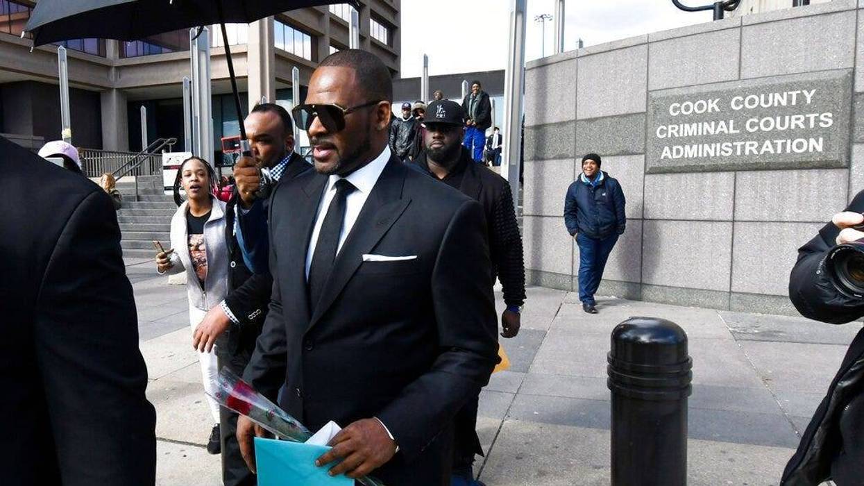 R. Kelly, front, leaves the Leighton Criminal Court after a hearing on Friday, March 22, 2019, in Chicago.