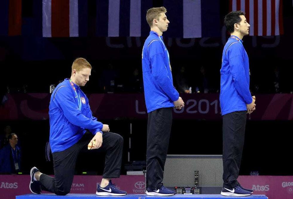 Race Imboden kneels
