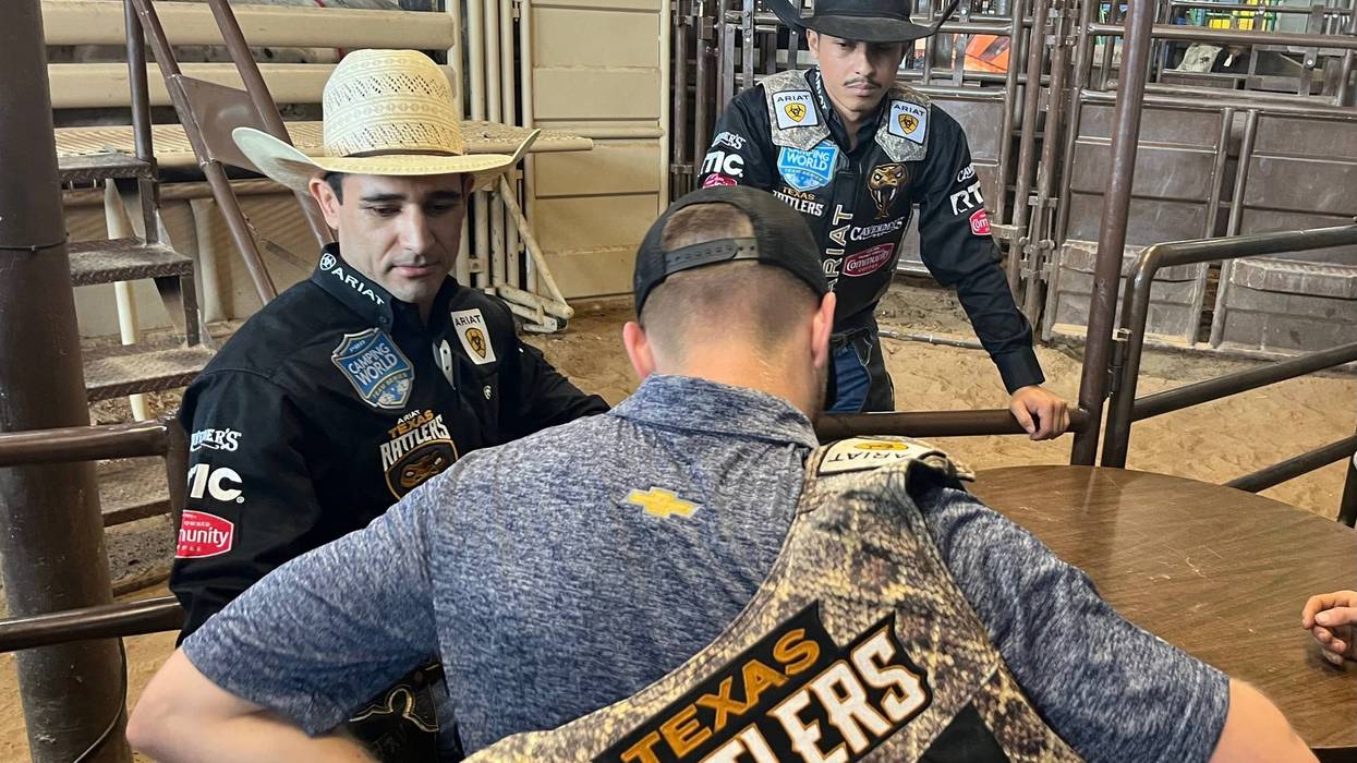 Racer and bull rider interacting