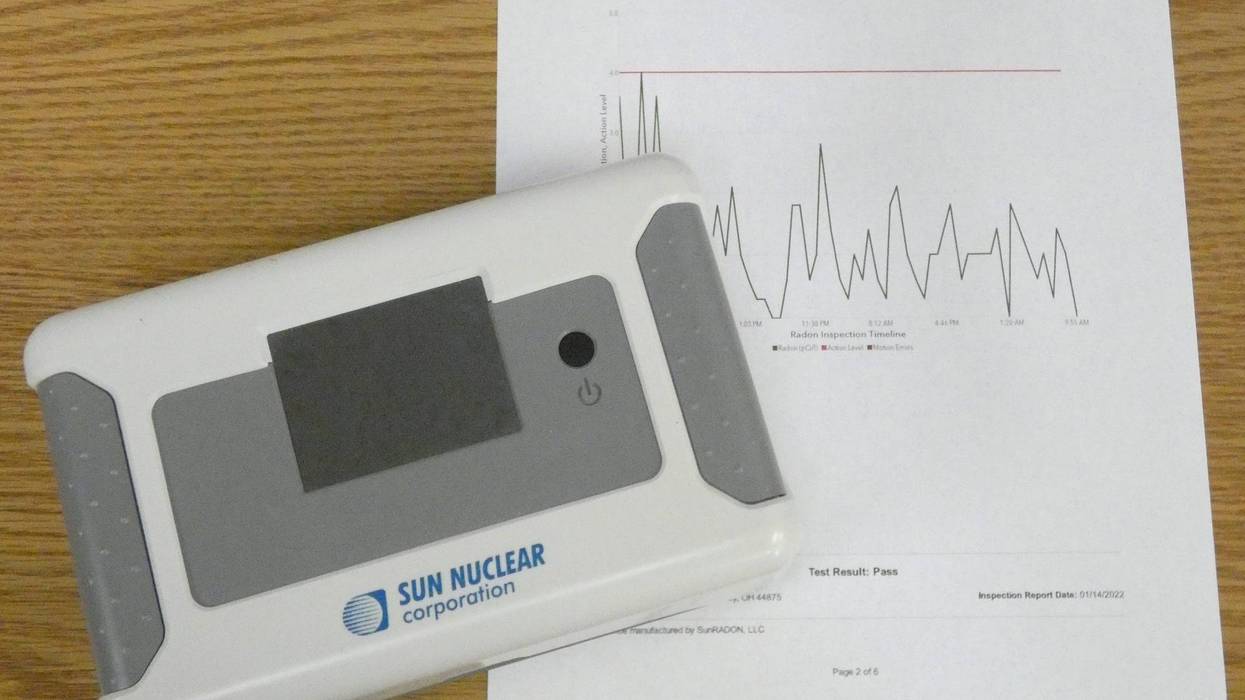 Radon testing meter, and a chart showing radon level fluctuation