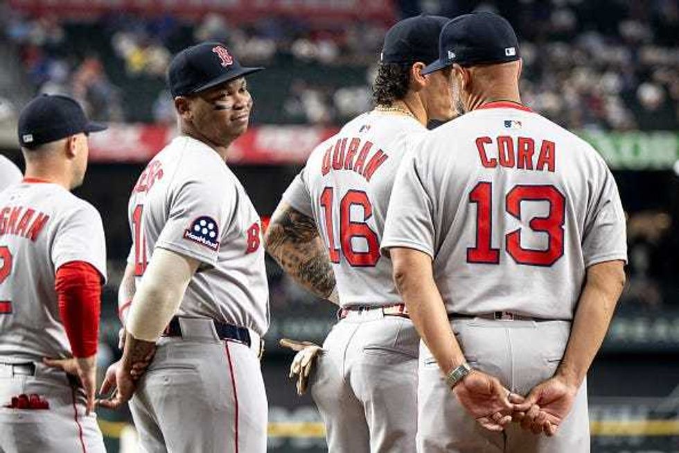 Rafael Devers and Alex Cora