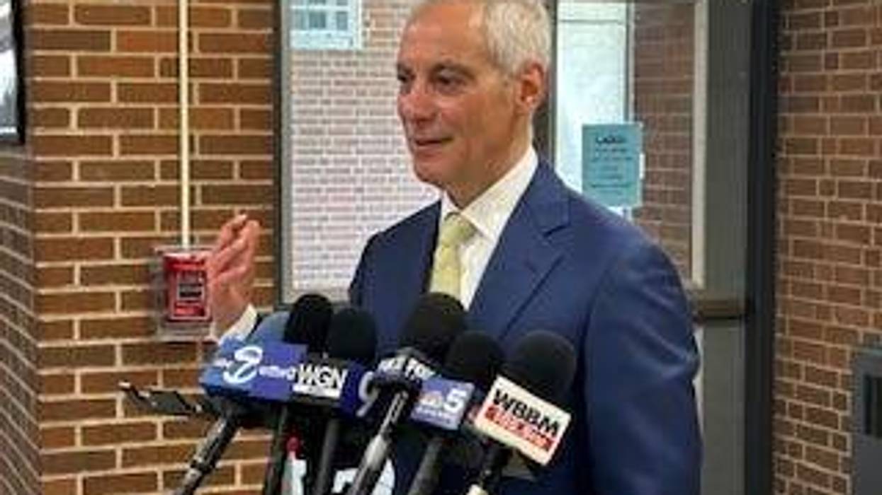 Rahm Emanuel talks with reporters at Rickover Naval Academy High School