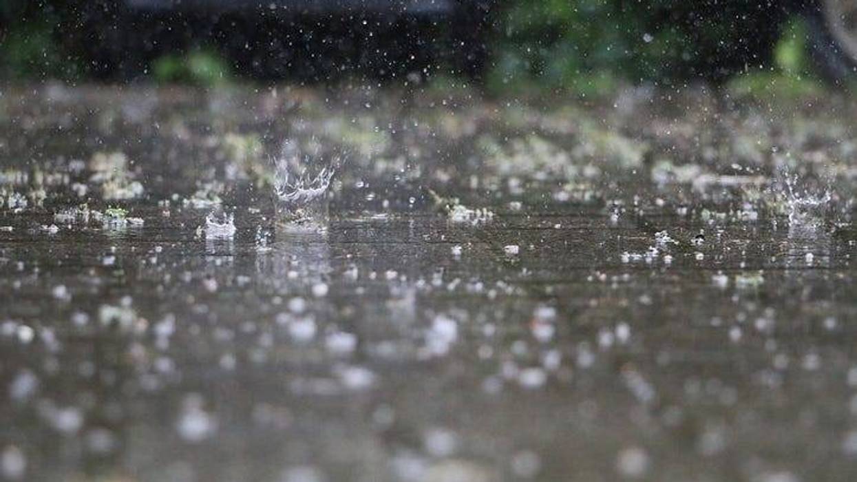 Rain strikes the pavement