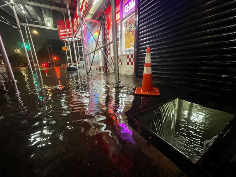 Rainfall from Hurricane Ida flood the basement of a Kennedy Fried Chicken fast food restaurant on September 1, 2021, in the Bronx borough of New York City
