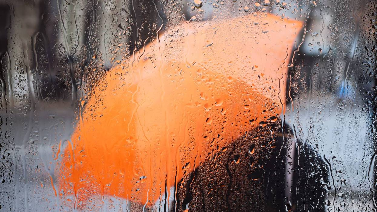 Rainy weather and raindrops on the glass. A window with raindrops.