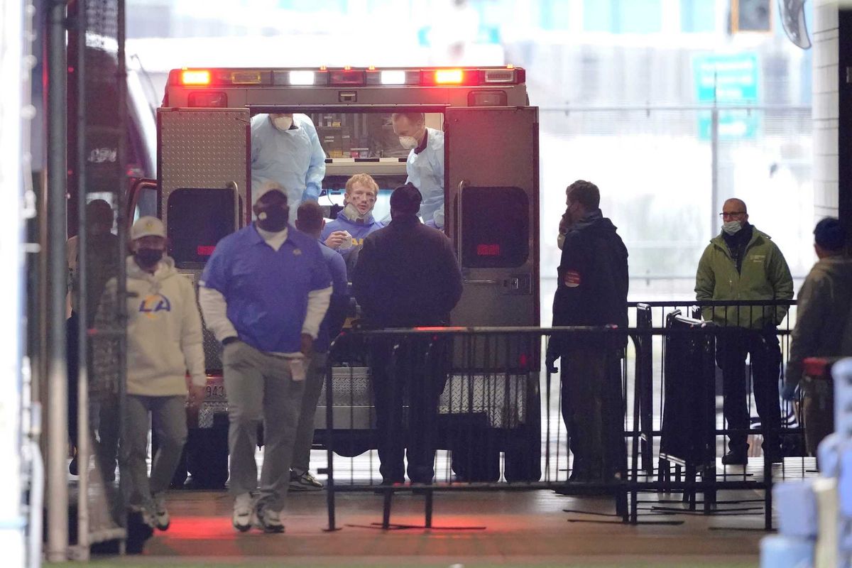 Rams quarterback John Wolford is loaded into an ambulance following a neck injury.