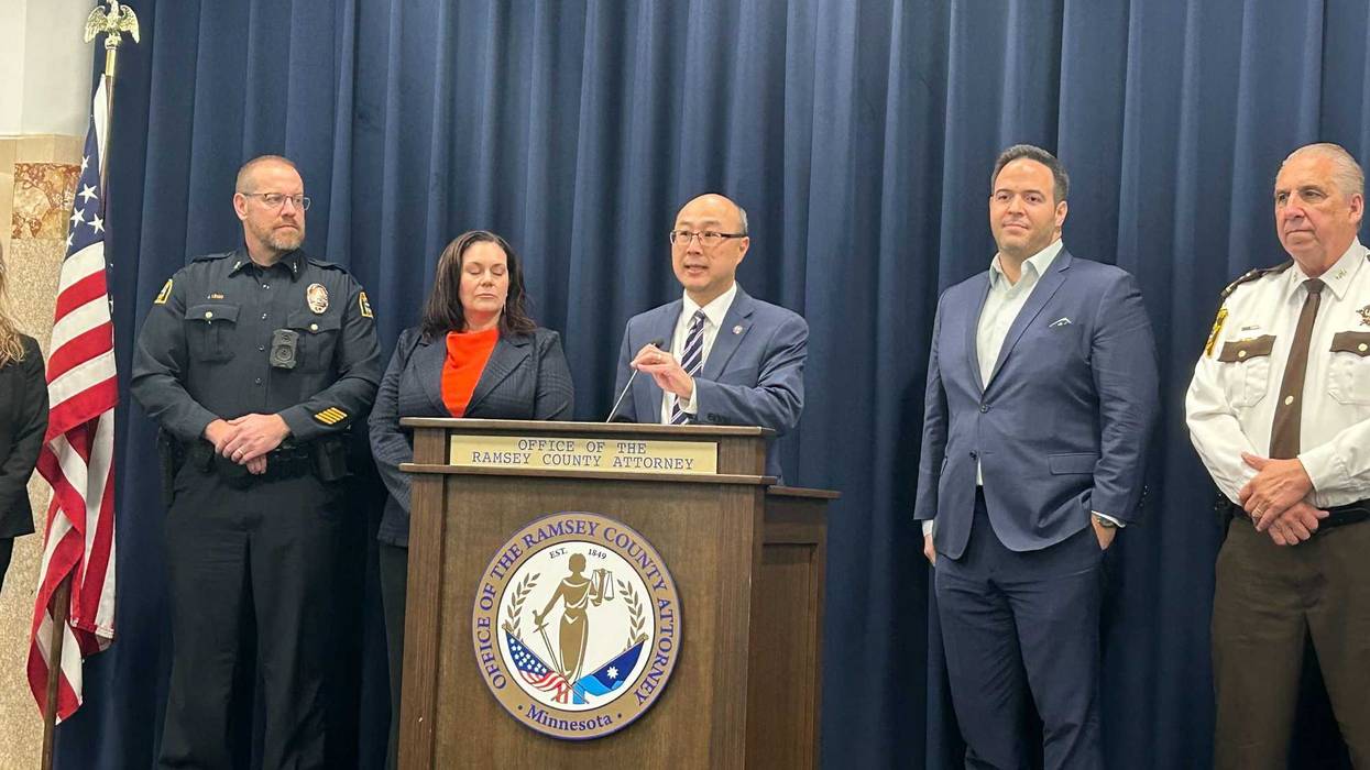 Ramsey County Attorney John Choi (at microphone), Ramsey County Sheriff Bob Fletcher (far right) and others announce new protocols in Ramsey County to get guns out of the hands of at-risk suspects.