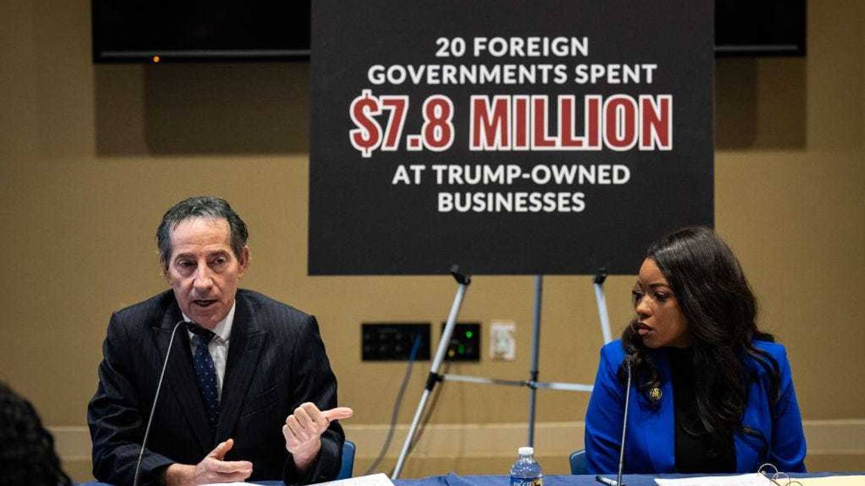 Ranking member of the House Oversight Committee Rep. Jamie Raskin (D-MD) speaks as Rep. Jasmine Crockett (D-TX) looks on during a media briefing concerning former President Donald Trump's business ties with foreign governments, on Capitol Hill January 4, 2024 in Washington, DC.
